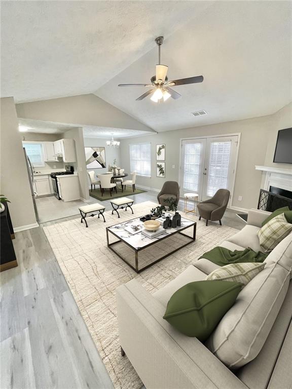 a living room with furniture and chandelier