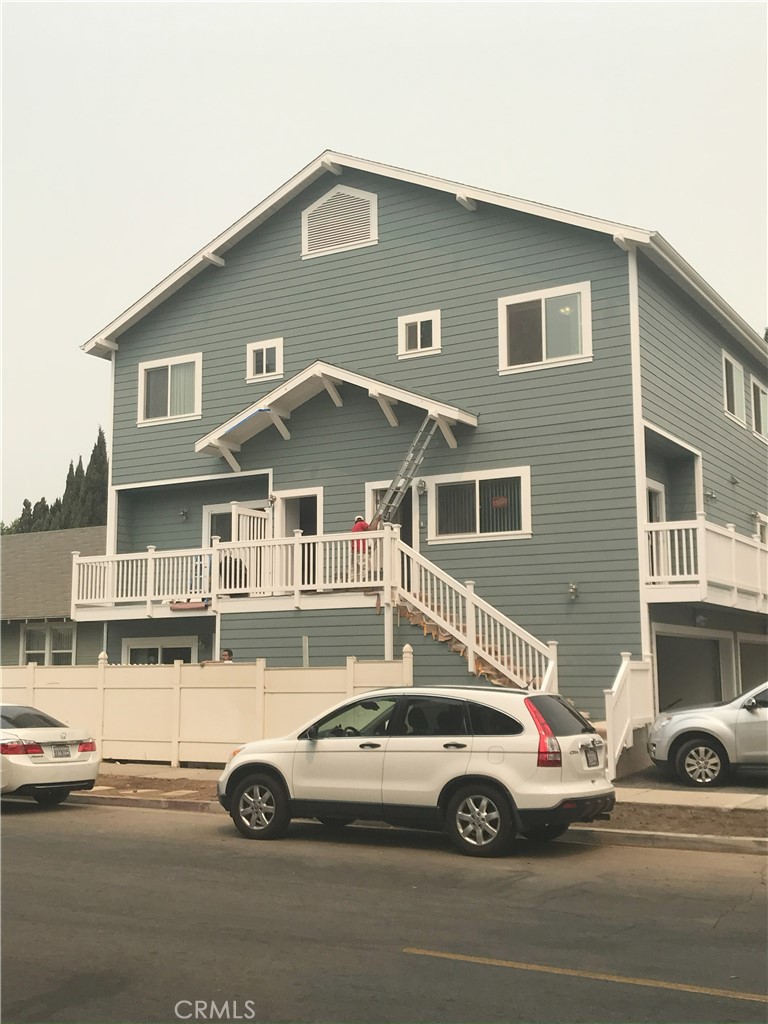 a front view of a house with parking space