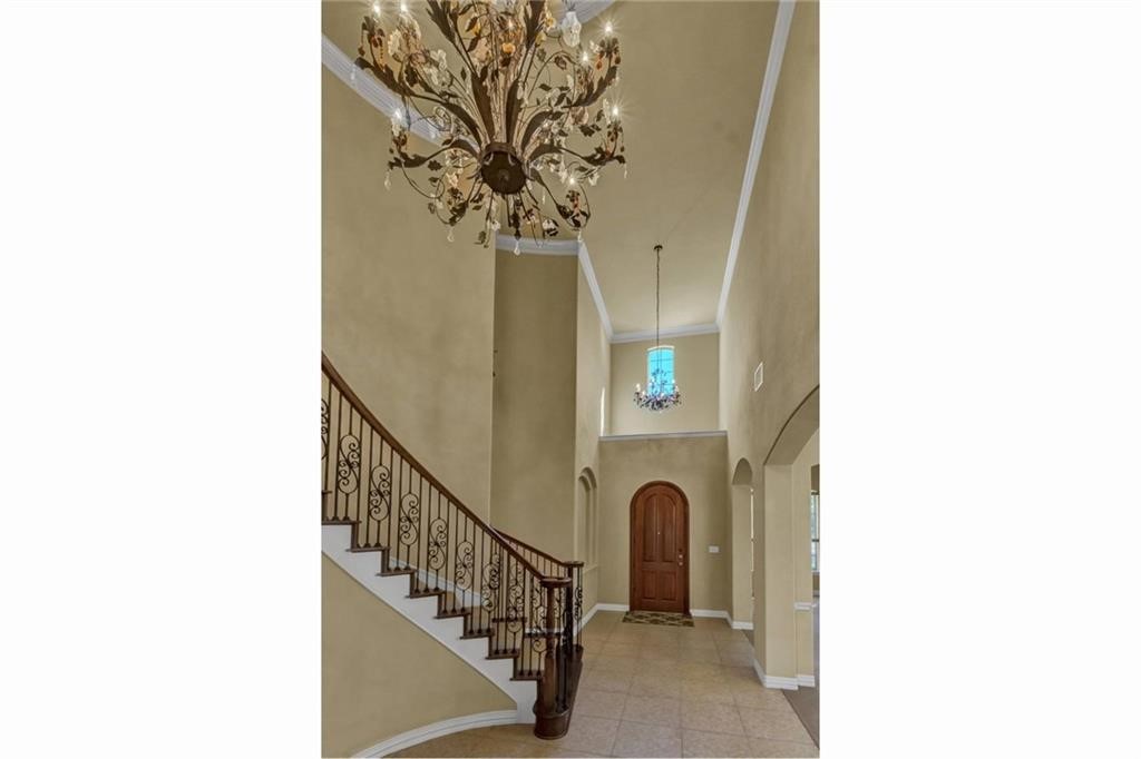 a view of entryway with paintings on wall