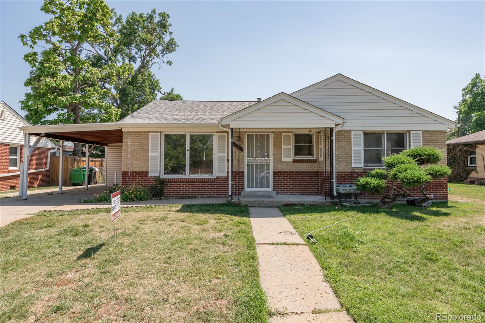 front view of a house with a yard