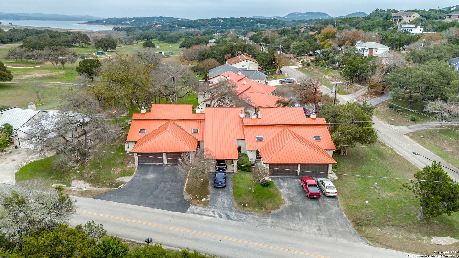 an aerial view of houses with yard