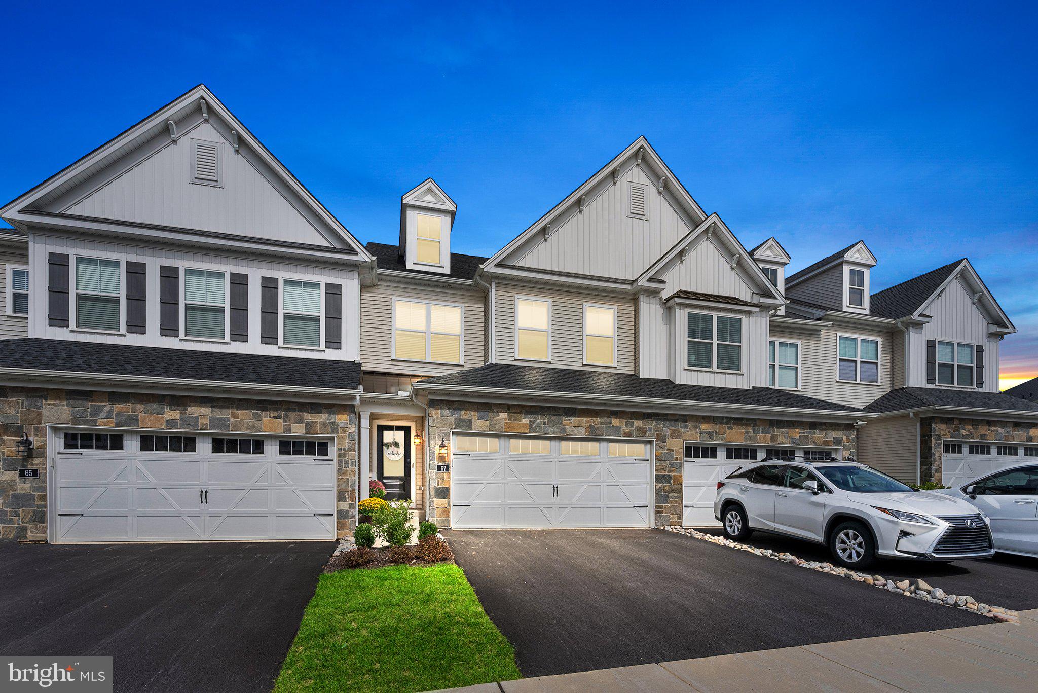 a view of multiple houses with a yard