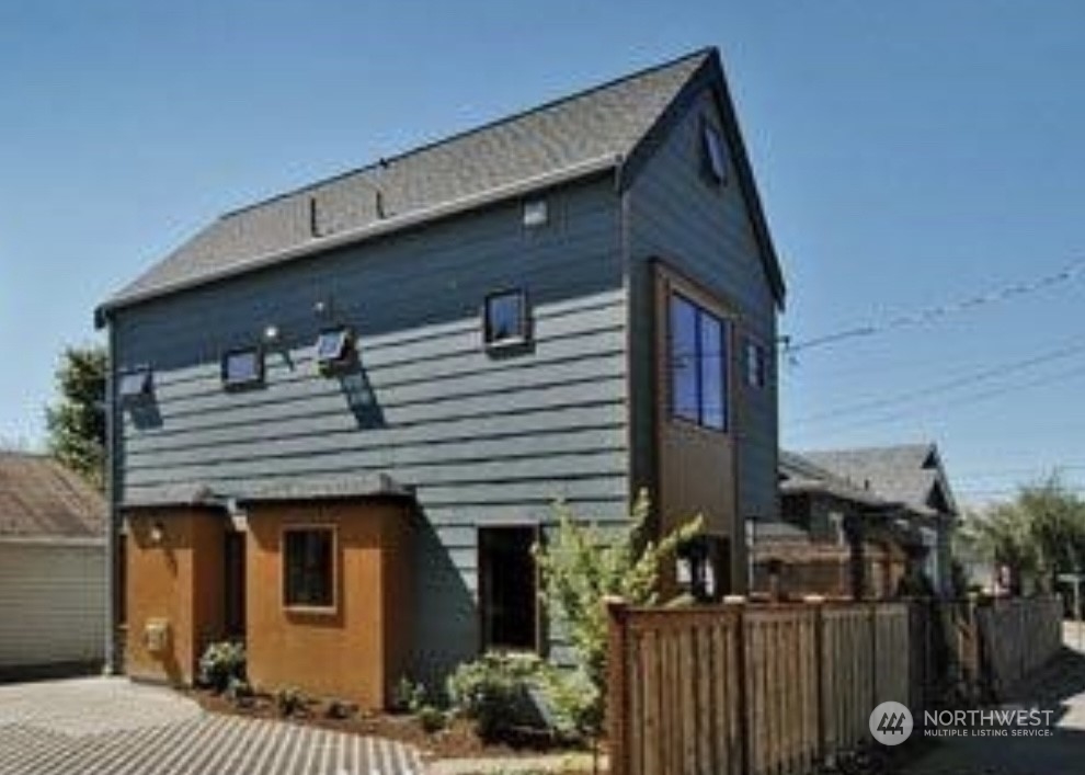 a front view of a house with parking area