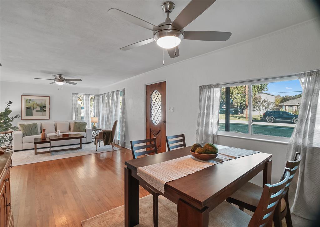 a view of a dining room with furniture window and outside view