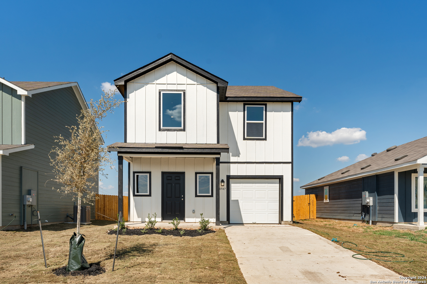 a front view of a house with yard