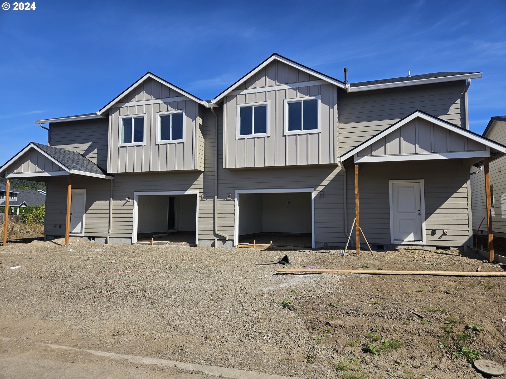 a front view of a house with yard