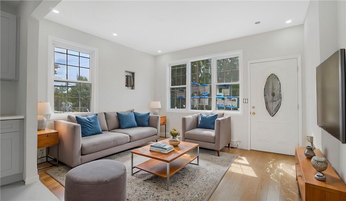 Living room with light wood-type flooring