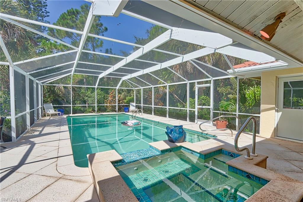 a view of a backyard with sitting area