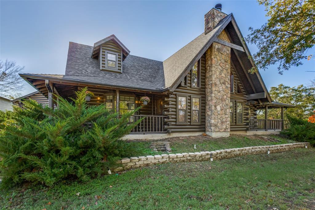 a front view of house with a garden