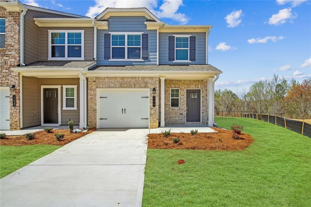 a front view of a house with a yard