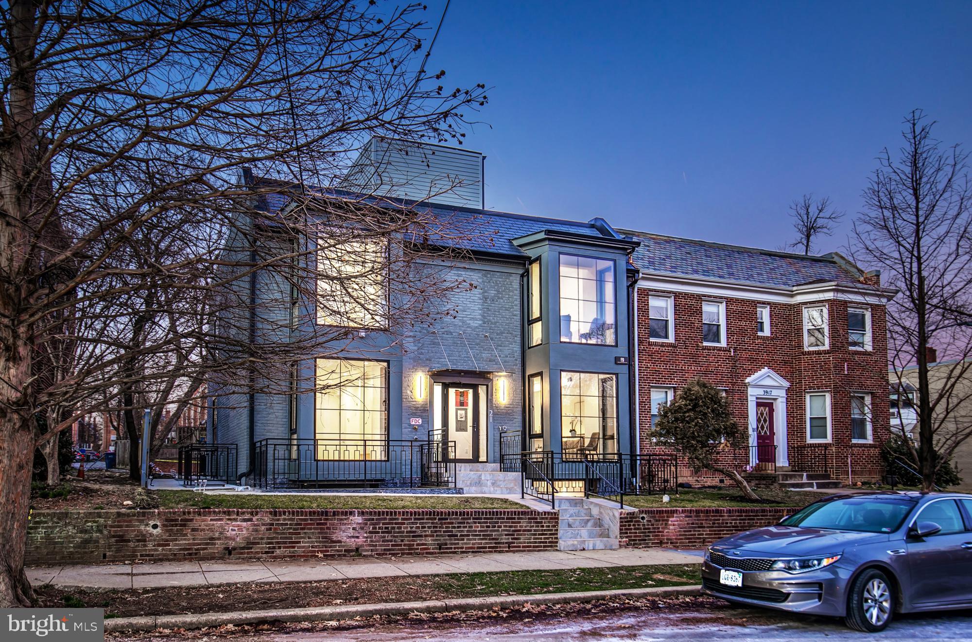 a car parked in front of a brick building