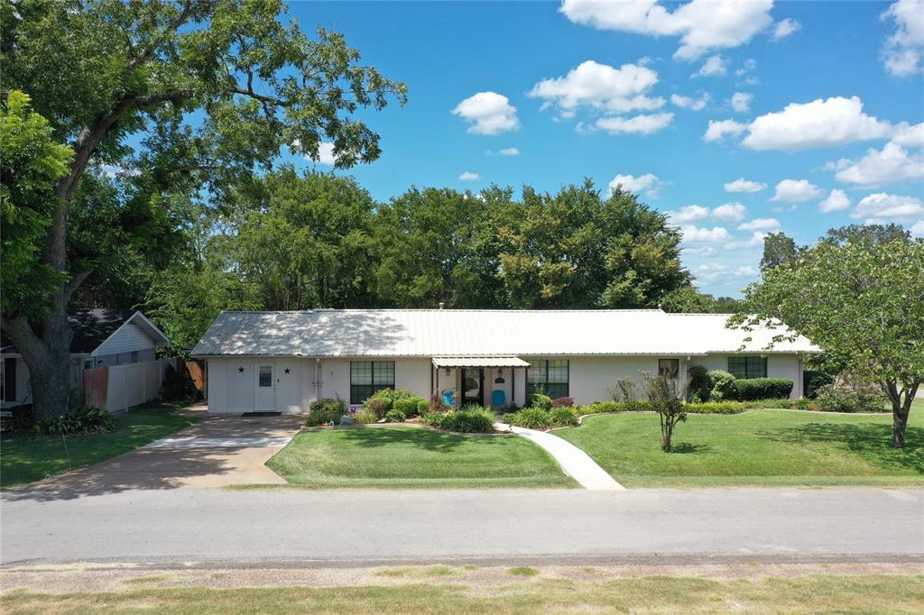 a view of house with yard and entertaining space