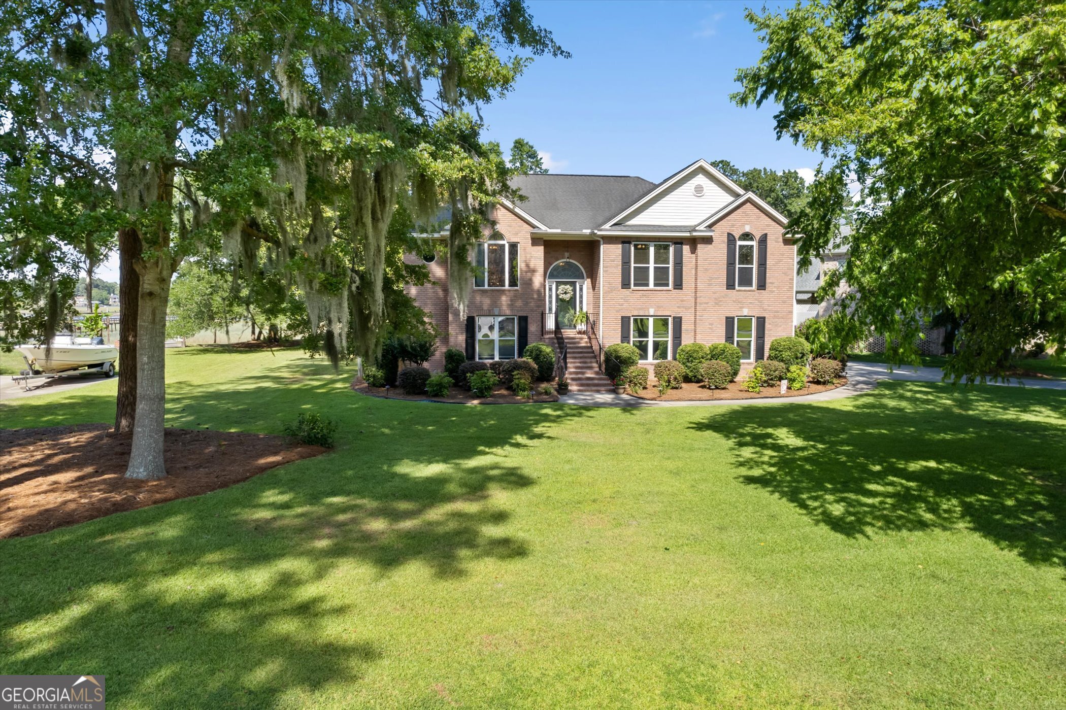 a front view of a house with garden