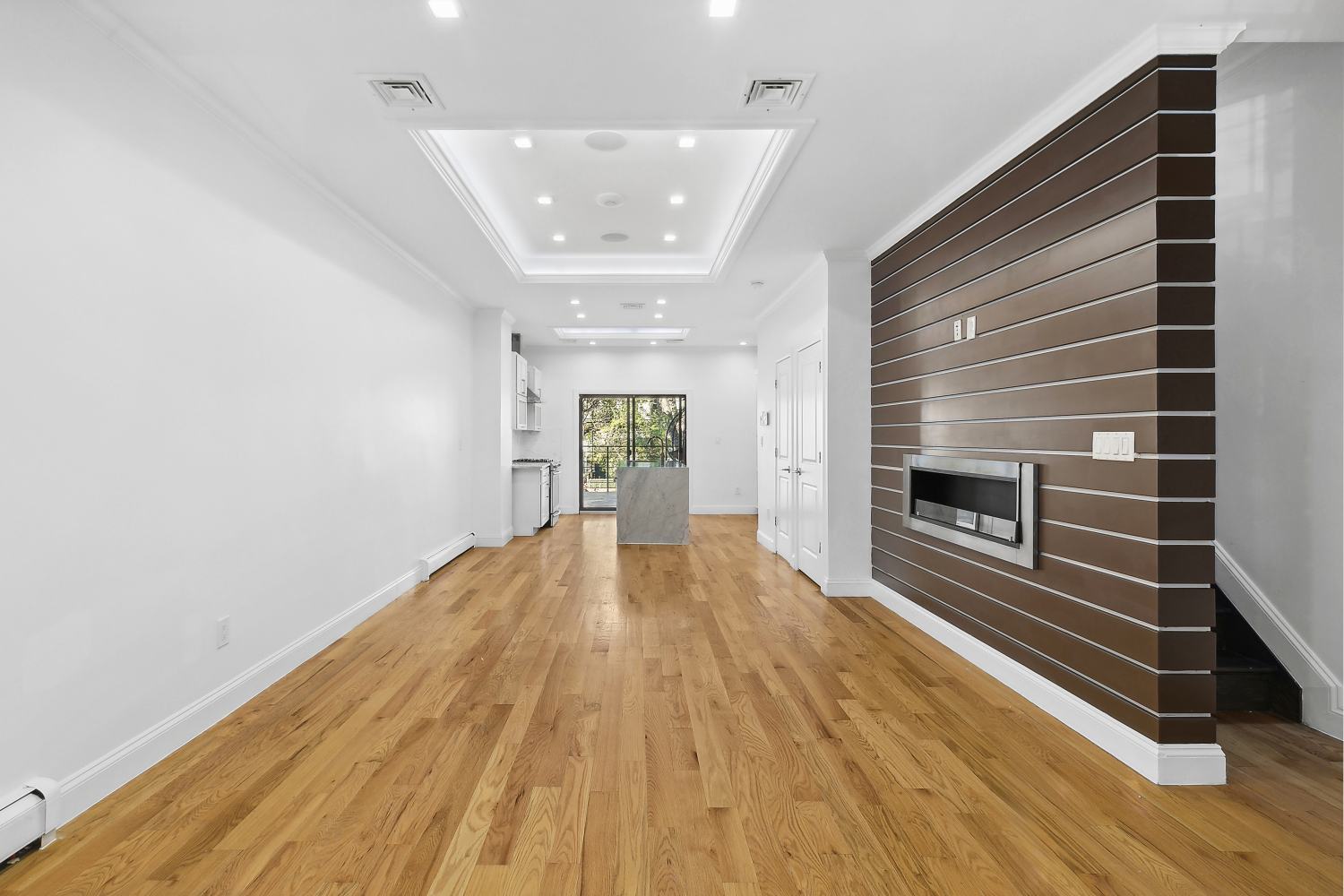 a view of an empty room and glass door