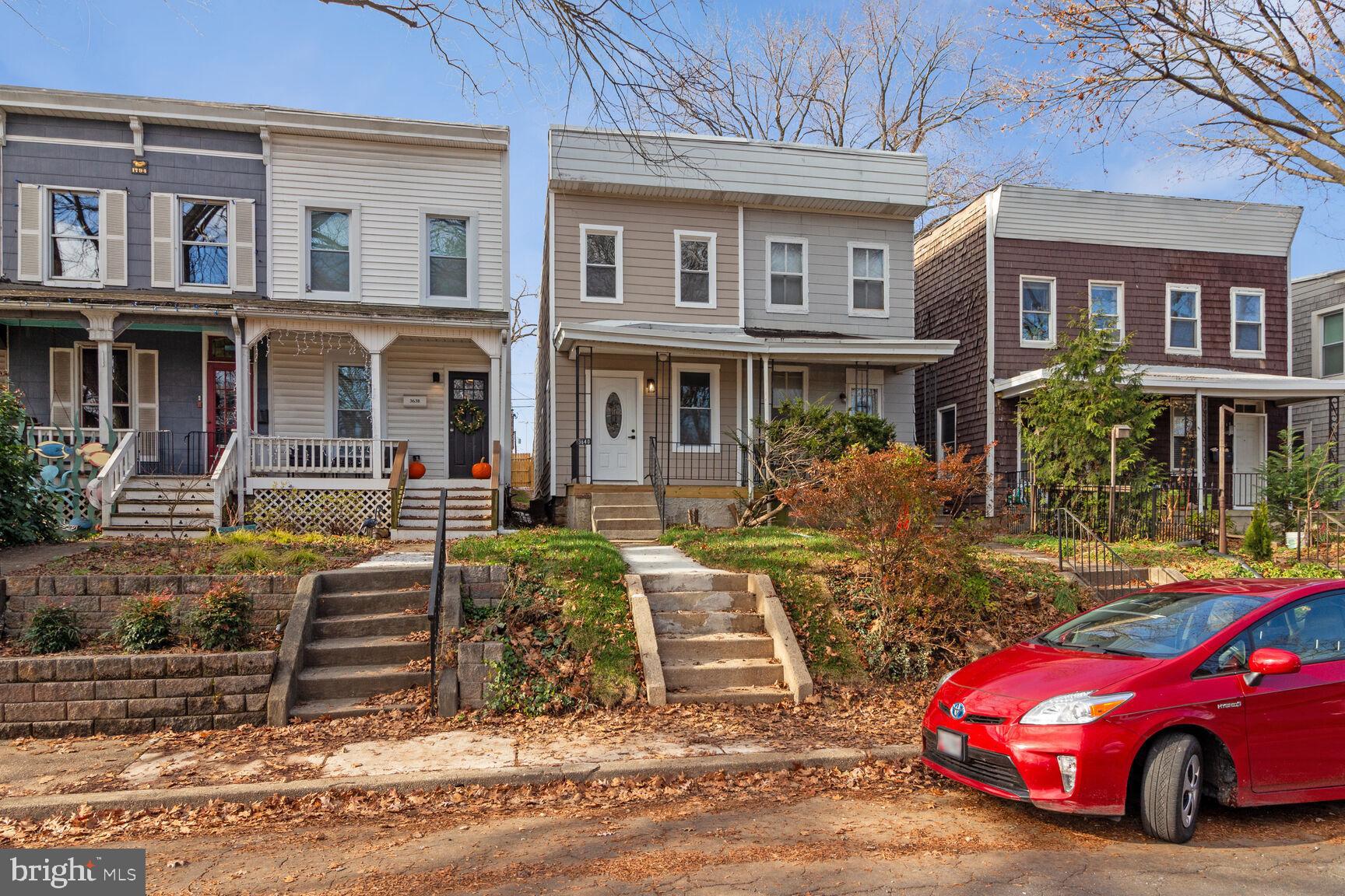 a front view of a house with parking space