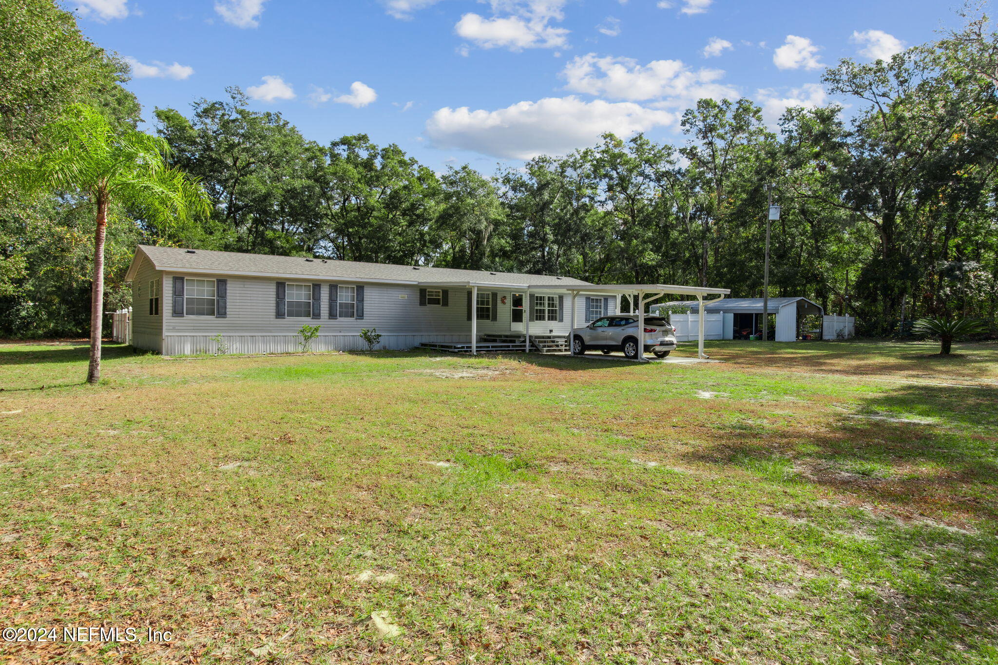 a view of a house with a big yard