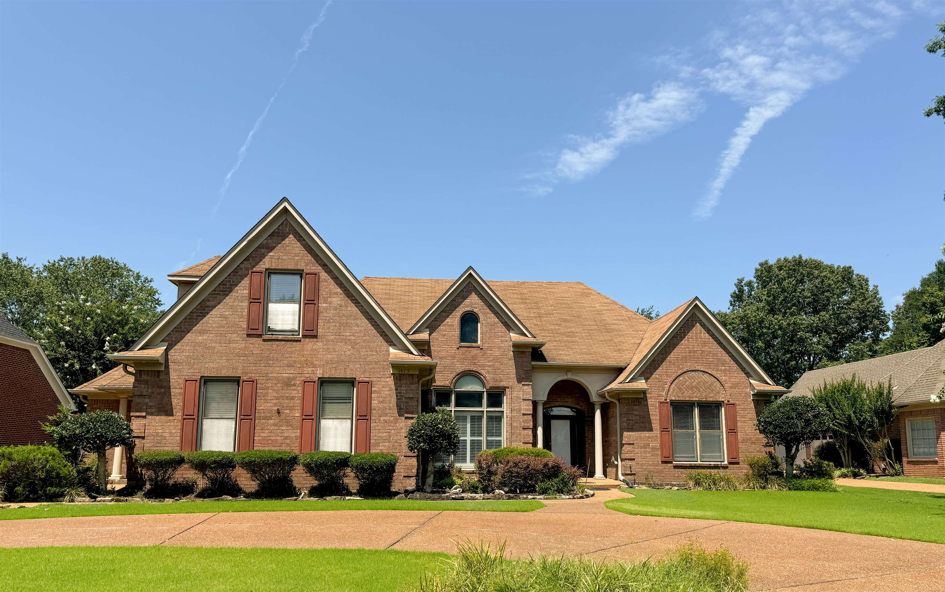 front view of a house with a yard