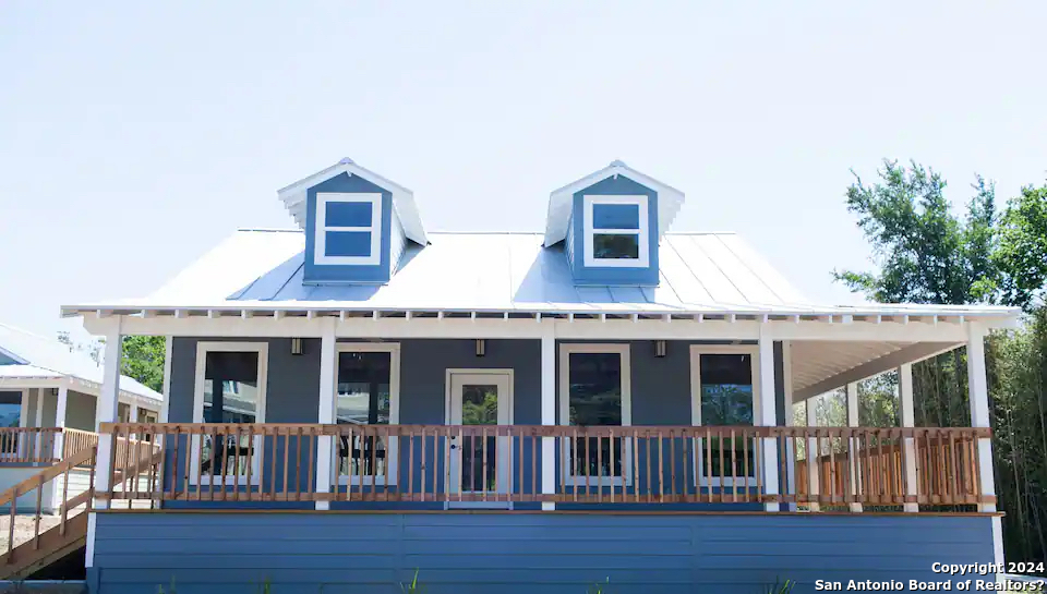 a front view of a house with a porch