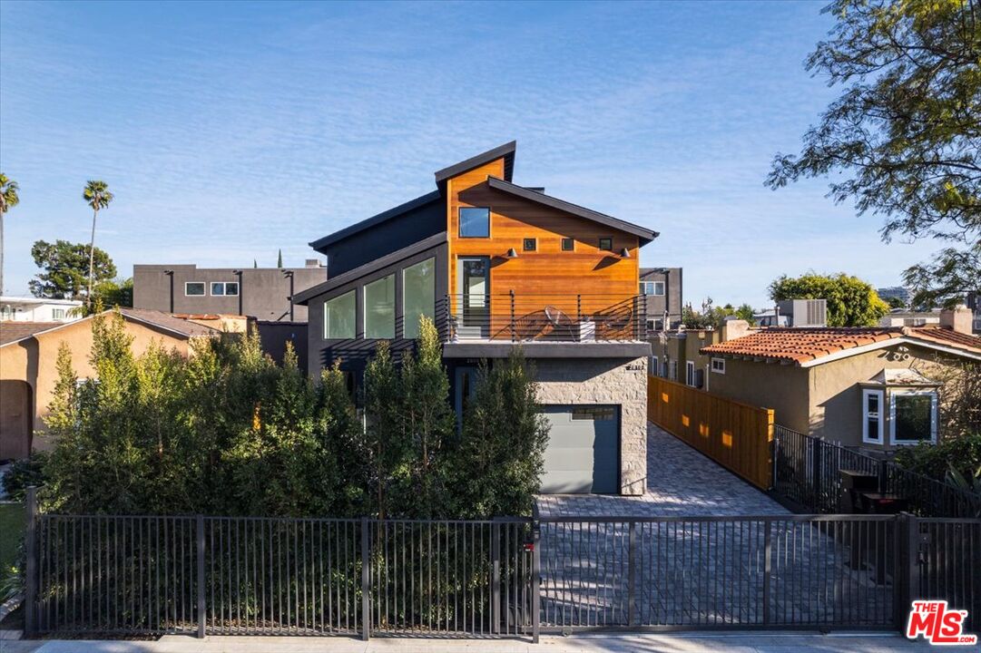 a front view of a house with a lake view