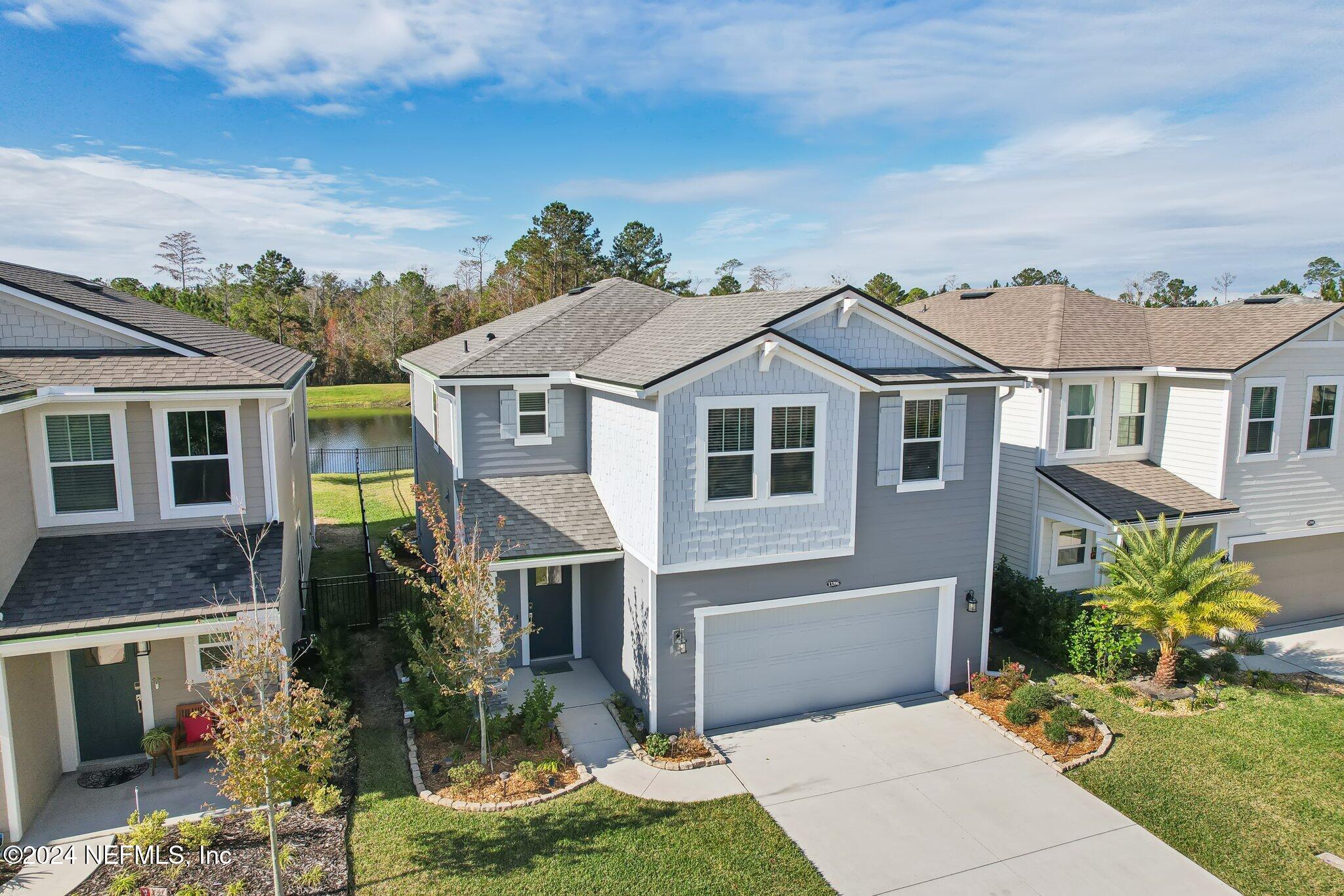 a aerial view of a house with a yard