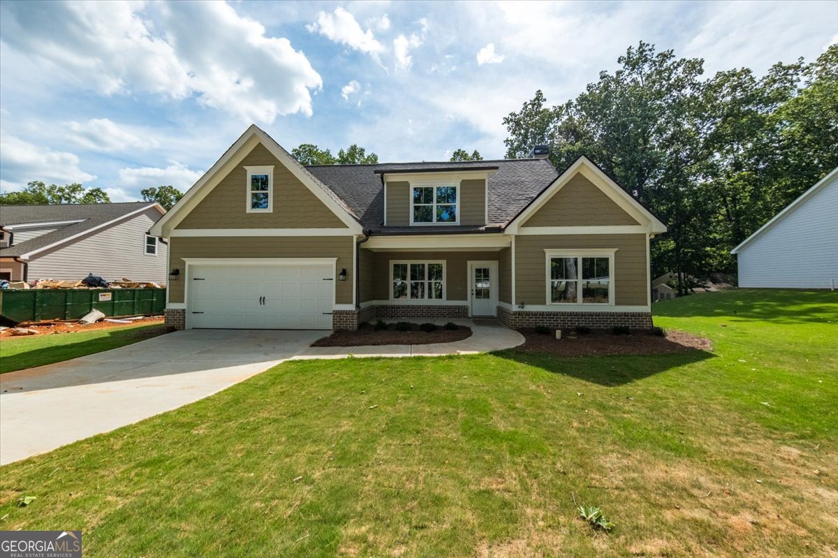 a front view of a house with a yard