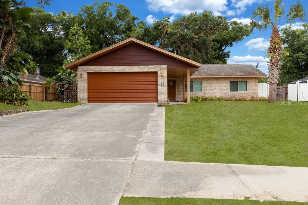 a front view of a house with yard