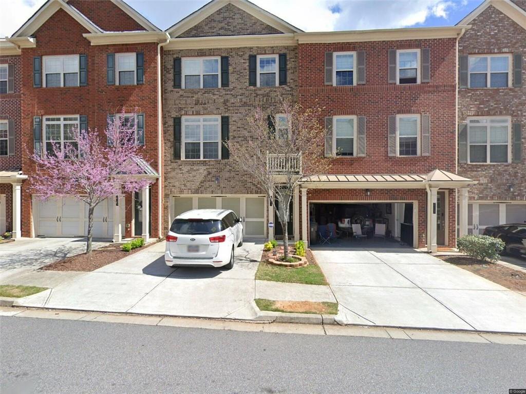 a car parked in front of a brick building