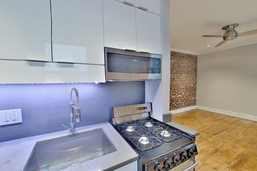 a kitchen with a stove and a microwave