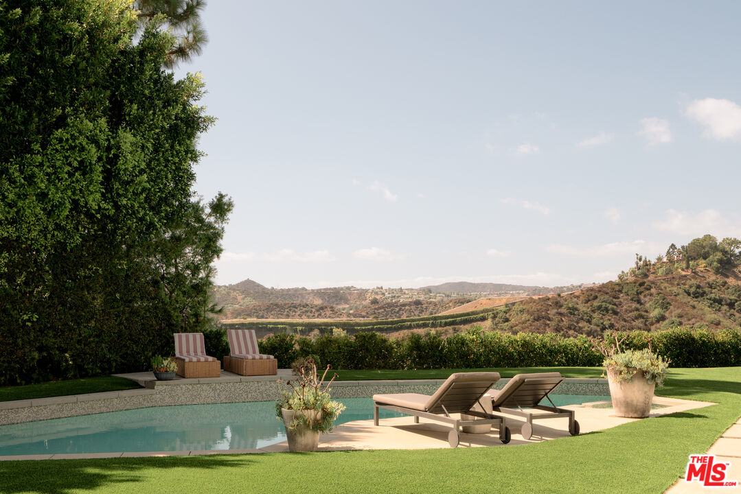 a view of a swimming pool with a patio