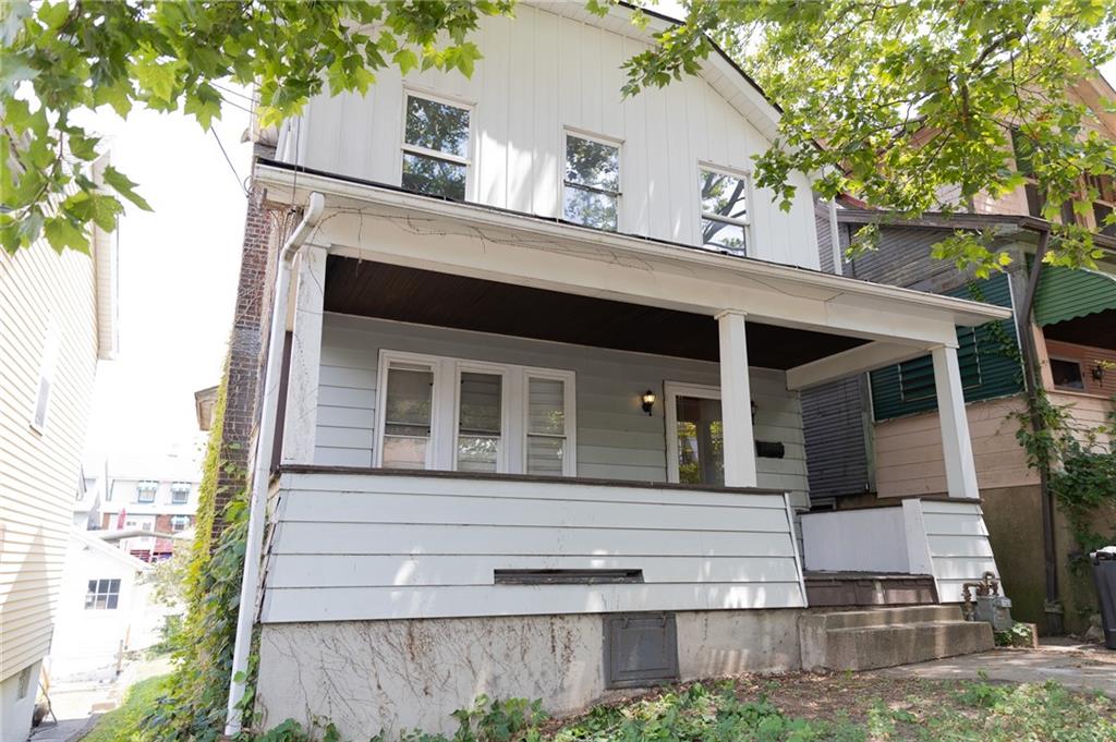 a front view of a house with garage