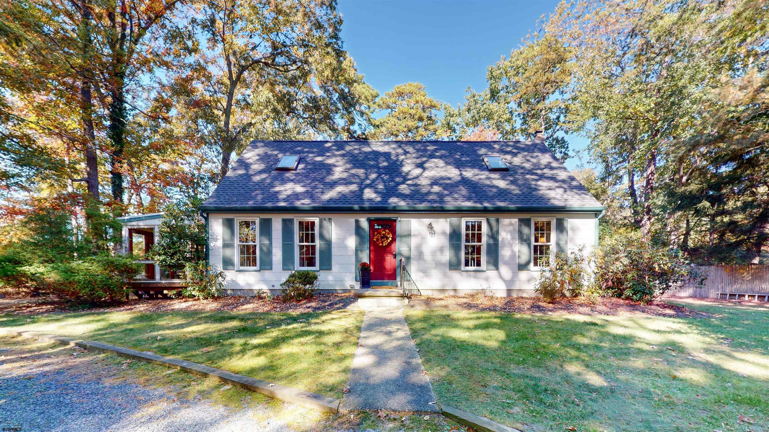 a view of house with outdoor seating