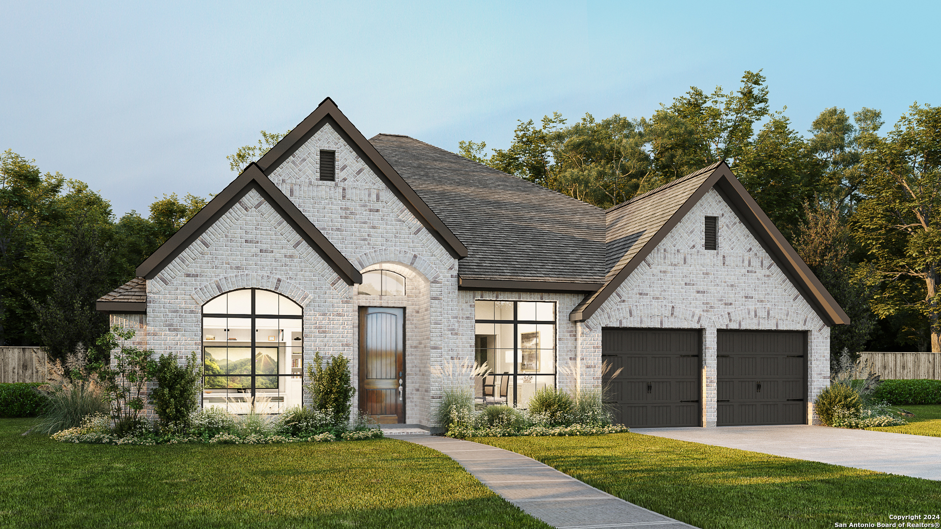 a front view of a house with a yard and garage