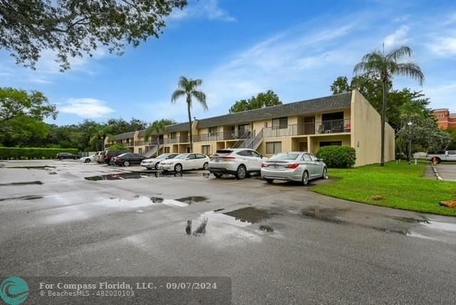 a row of cars parked in front of a house