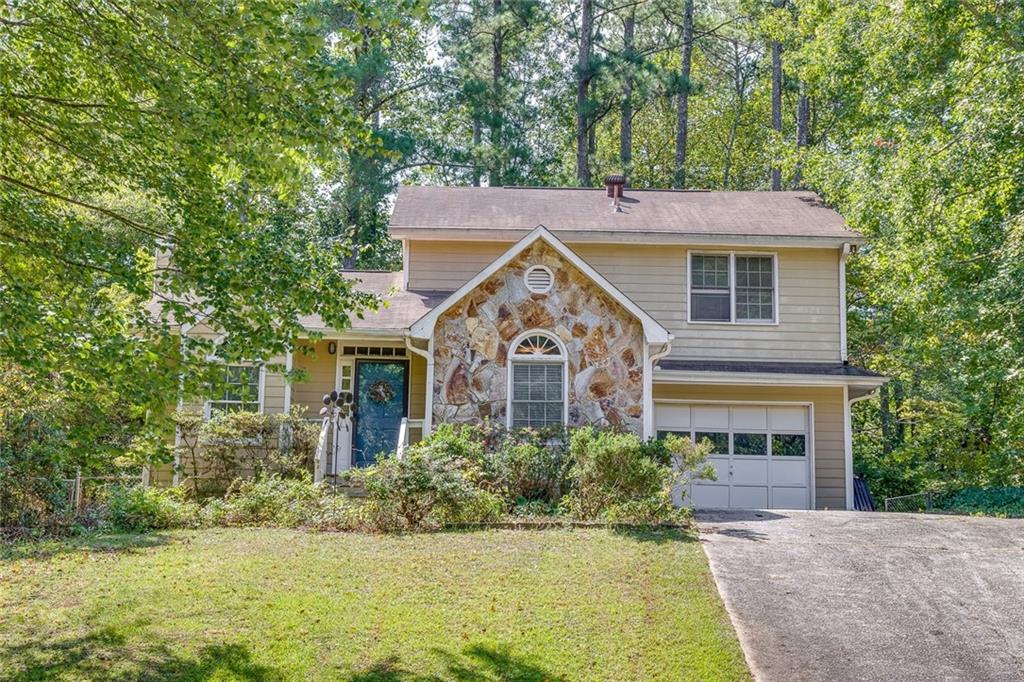 front view of a house with a yard