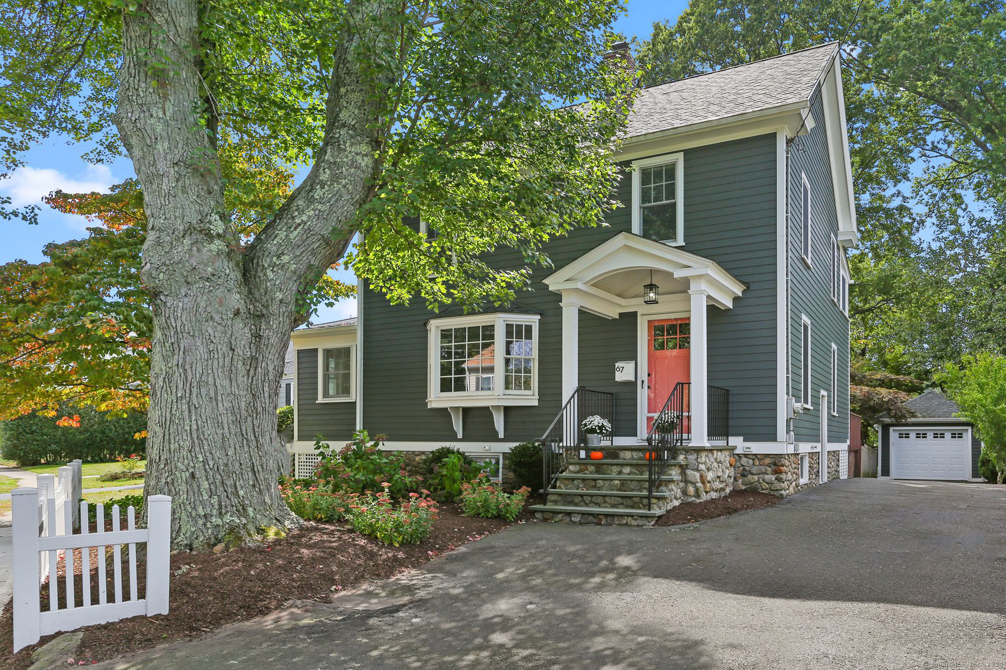 front view of a house with a yard