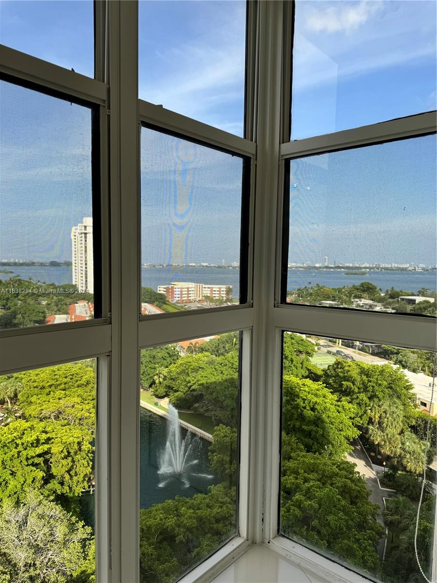 a view of a glass door with wooden floor