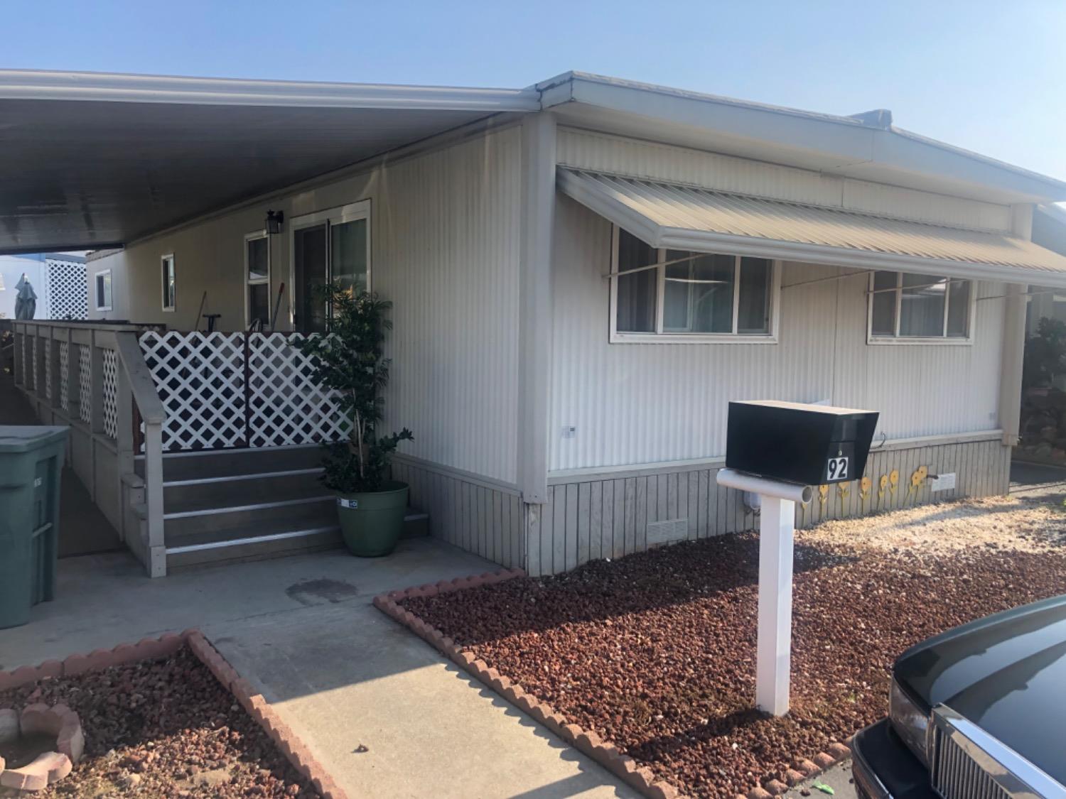 a front view of a house with parking