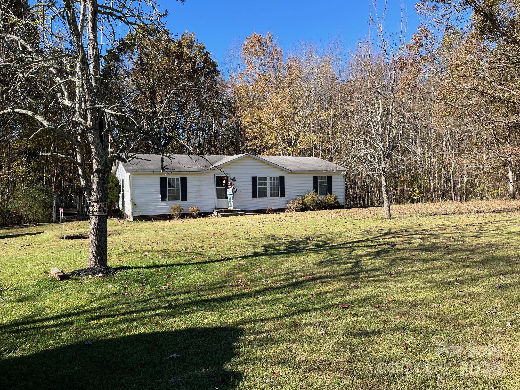 a house with trees in the background