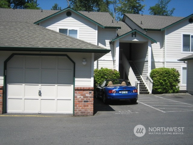 a front view of a house with garage