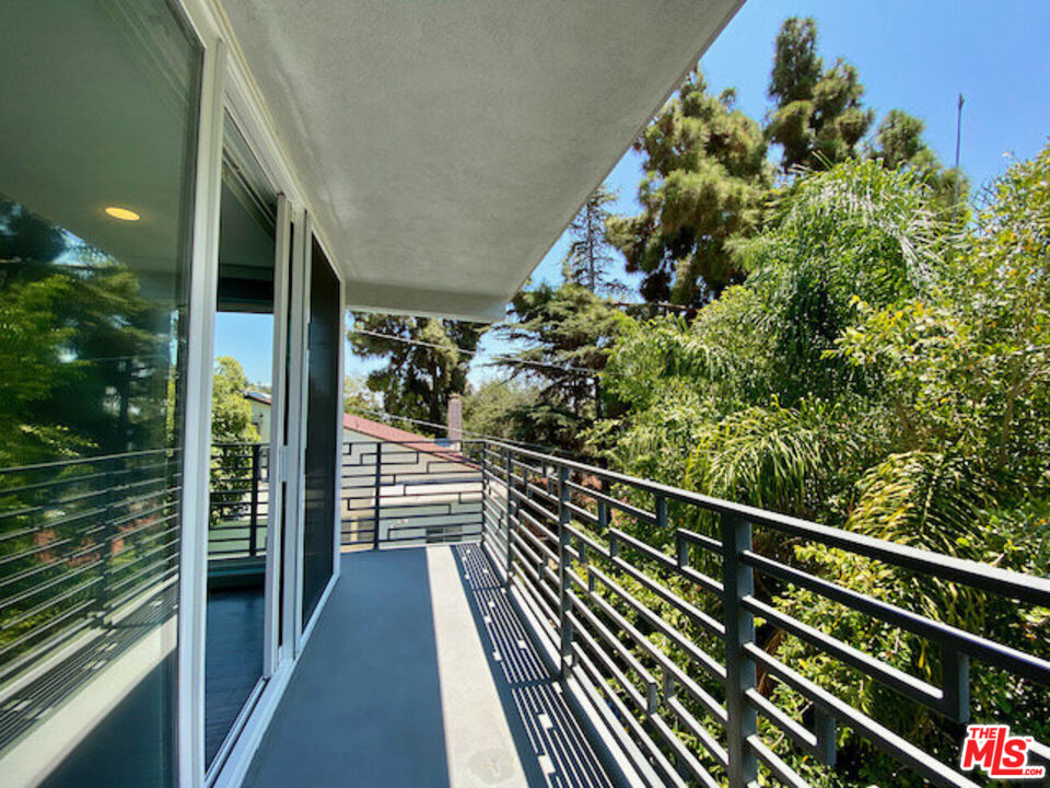 a view of balcony and yard