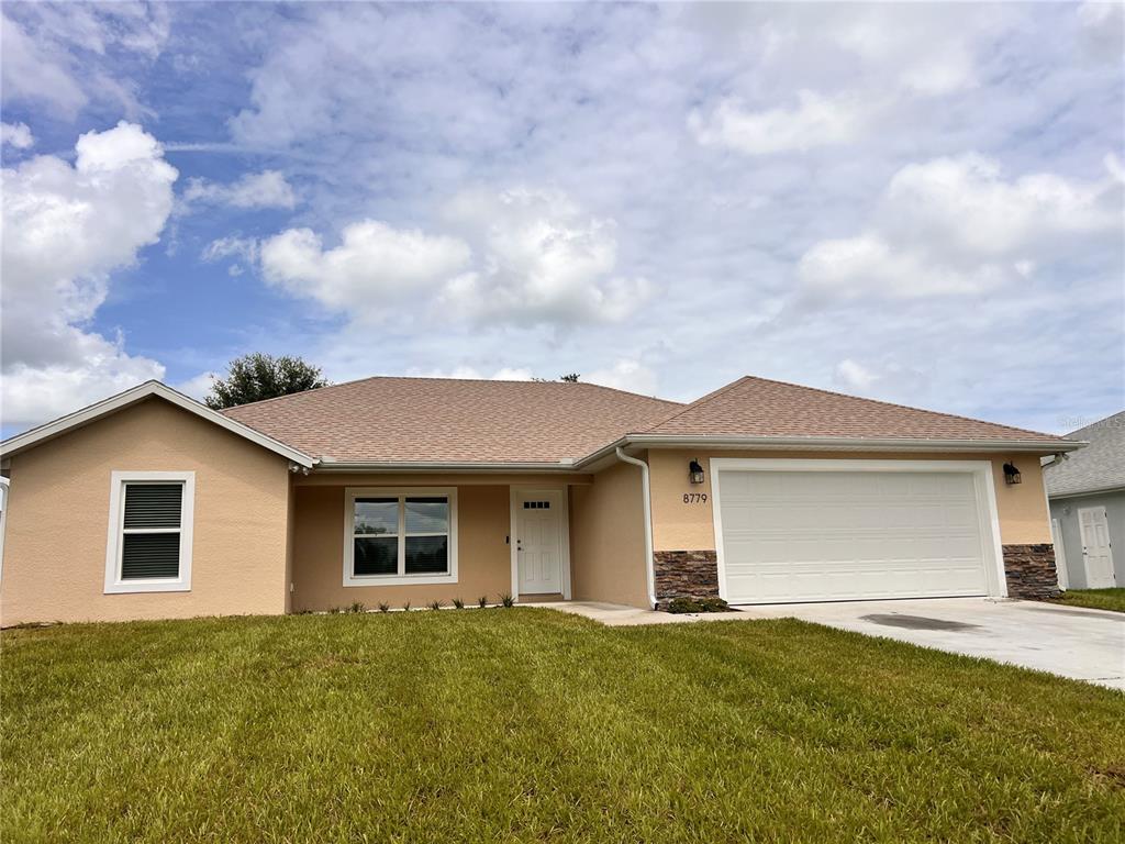 front view of a house with a yard