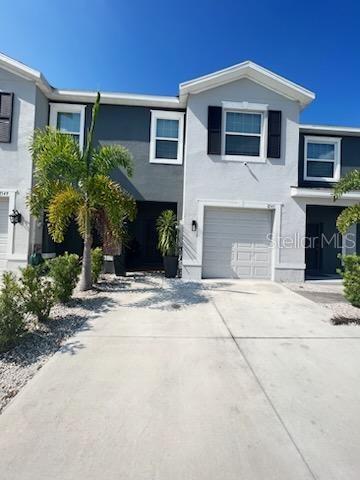 a front view of a house with yard