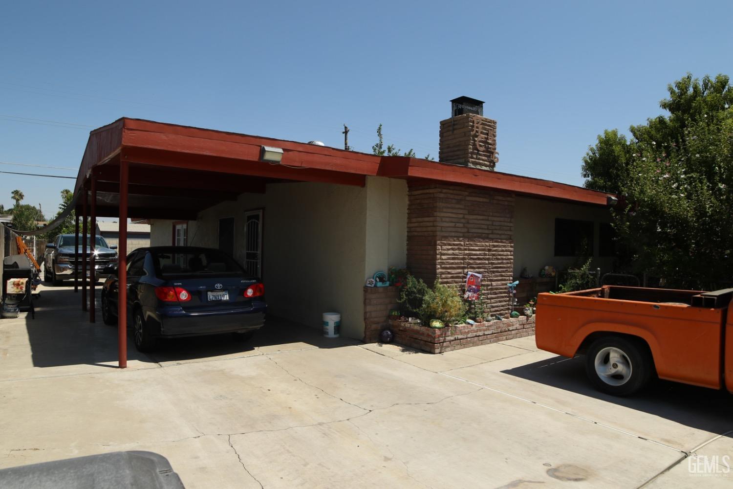 a view of a car parked front of a house