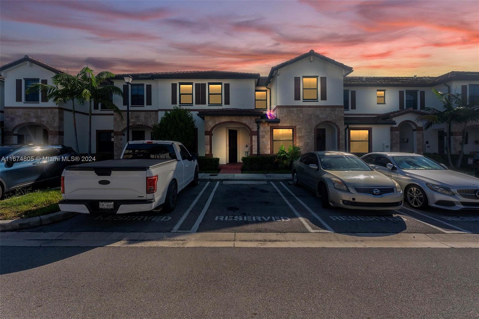 a front view of a house with parking space