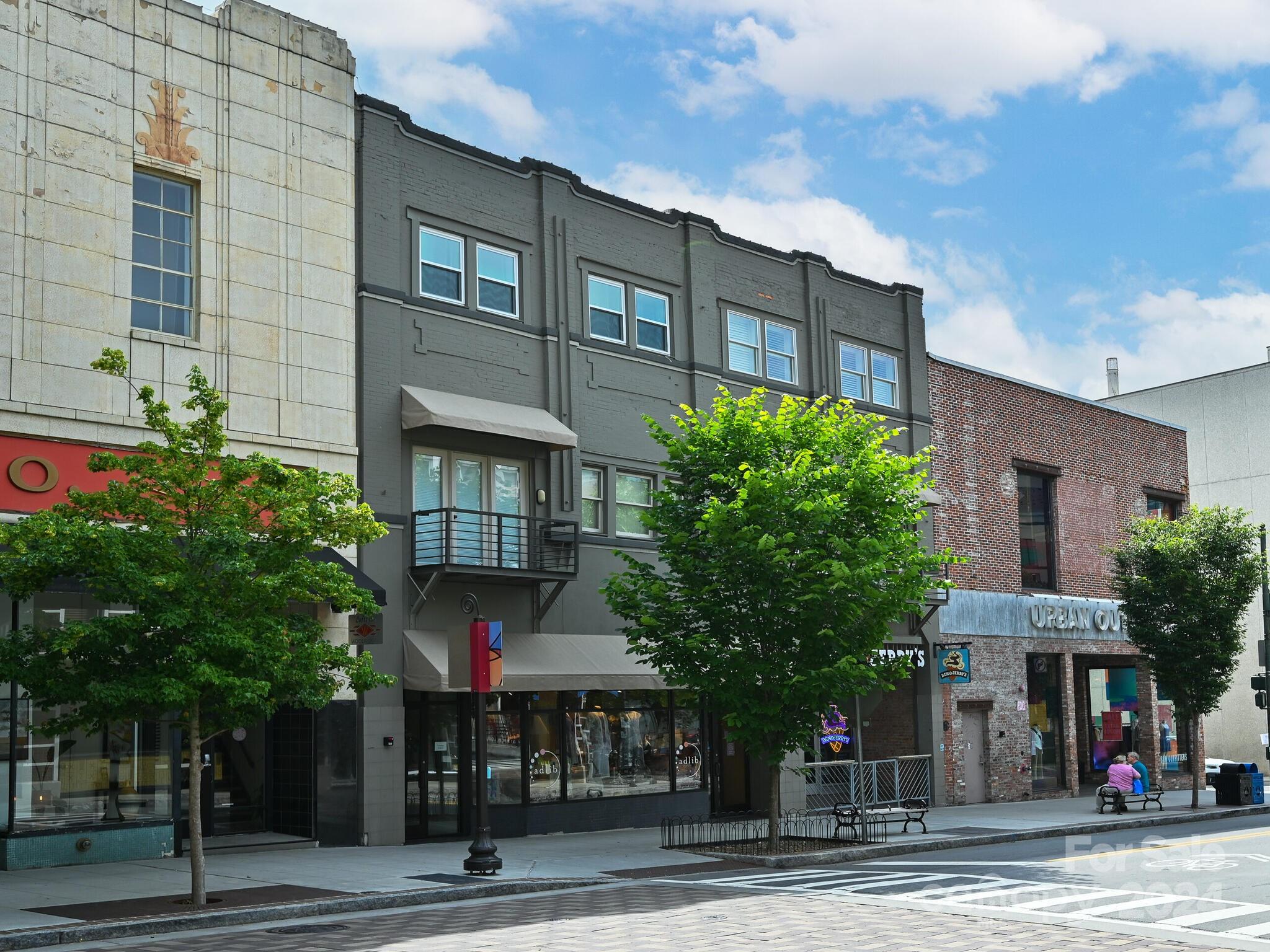 a view of a building and a street light pole