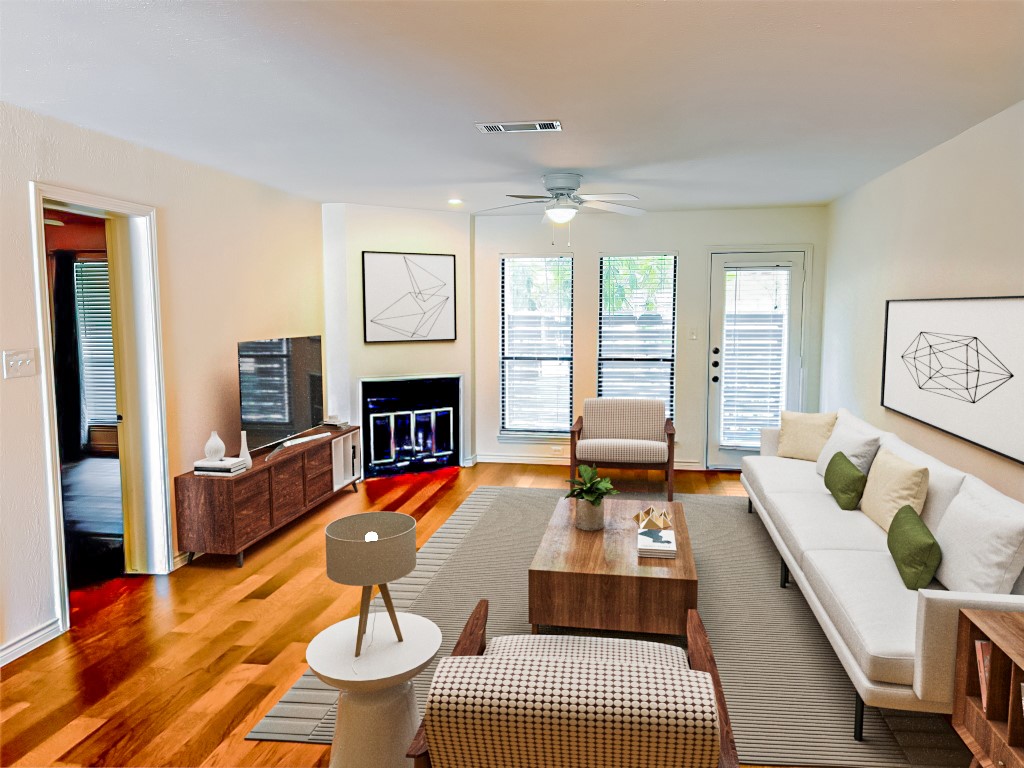 a bedroom with furniture and a fireplace