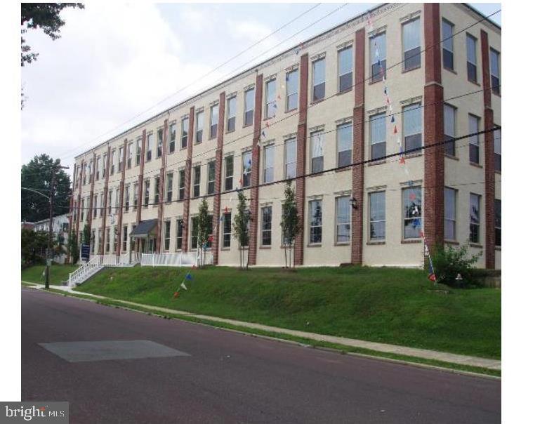 a view of a building with a yard