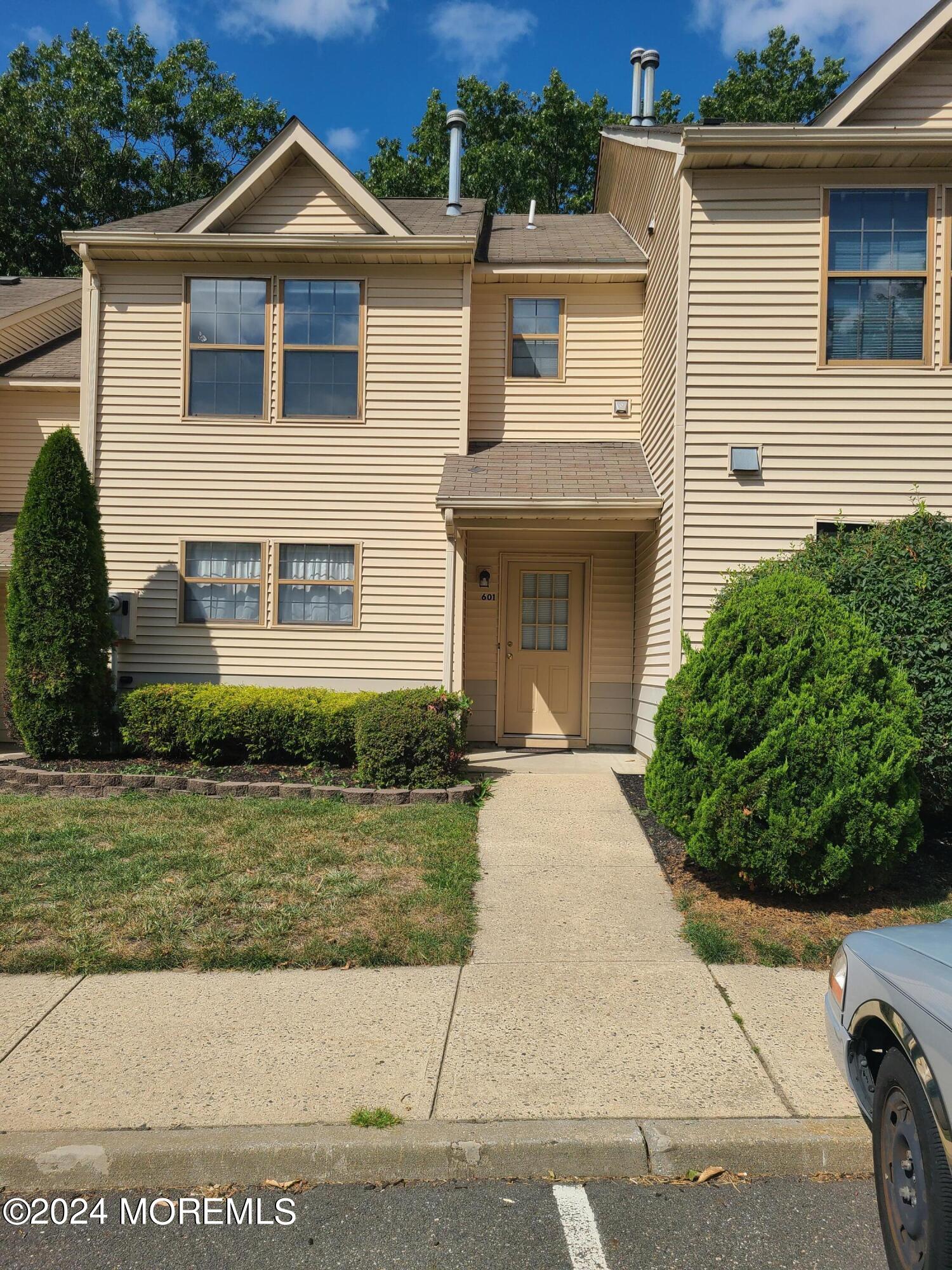 a front view of a house with a yard