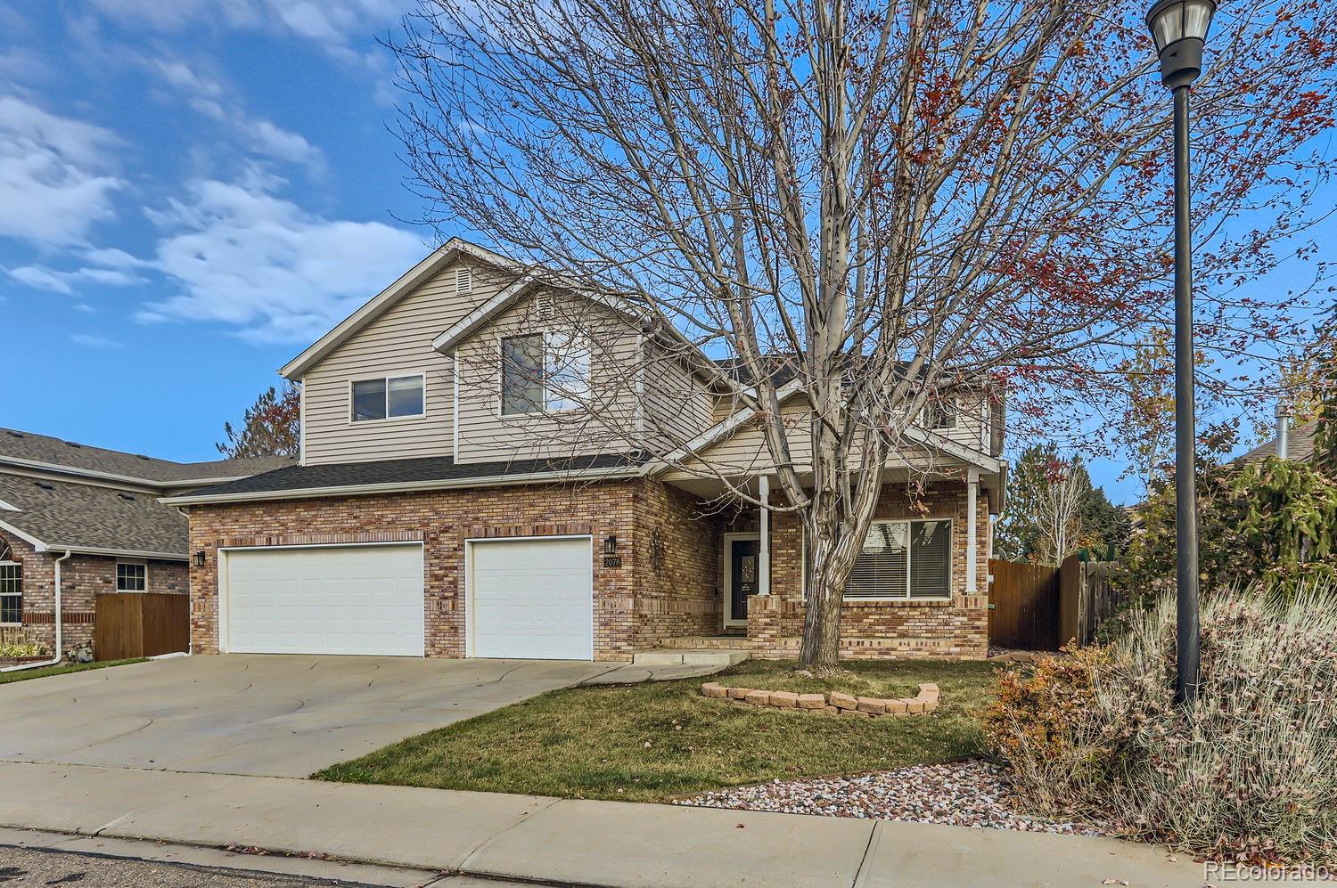 a front view of a house with garage