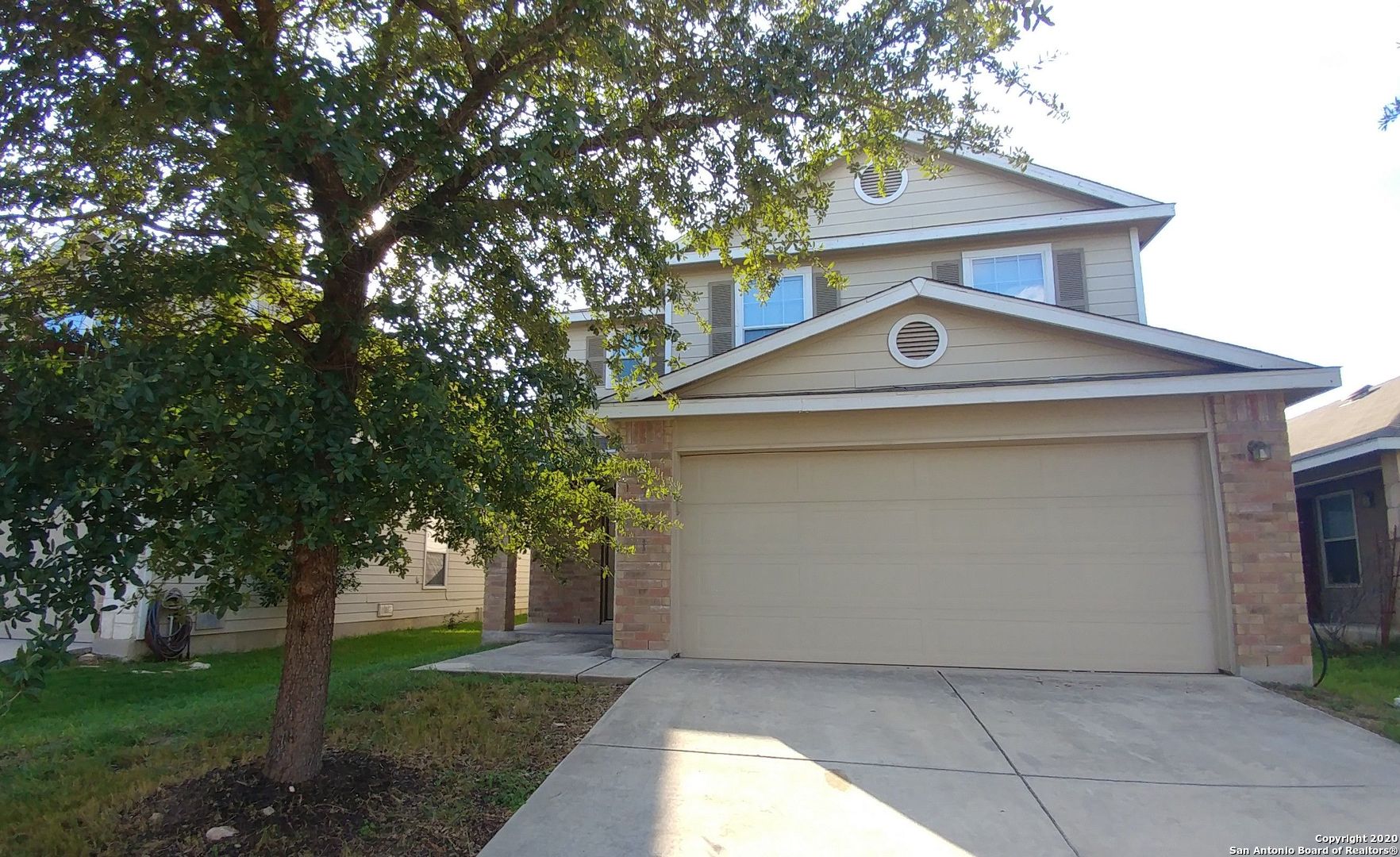 a front view of a house with yard